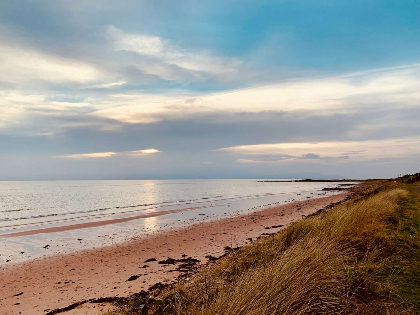 Evening light on a long sand beach of the Ayrshire coast